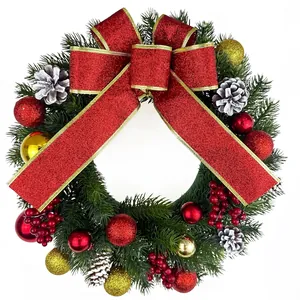 Couronne de Noël pour décoration de porte avec grand nœud rouge pailleté et pommes