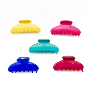 Set of five colorful acetate shark hair clips in yellow pink blue for hair updos