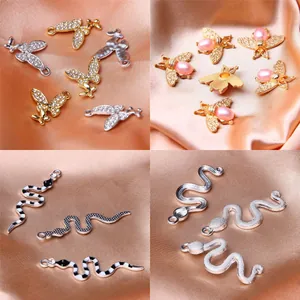 Set of assorted alloy animal charms including snakes and bees for DIY jewelry making