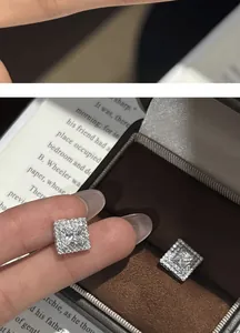 Close-up macro shot of geometric square zircon stud earrings with sparkling micro-pave