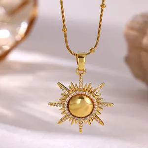 Close-up of sunburst pendant necklace with 18K gold plating and micro-paved zircons