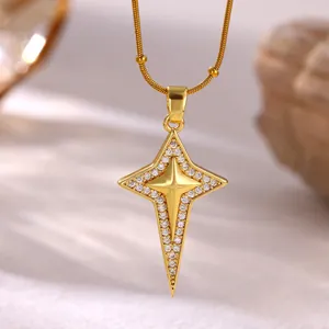 Close-up of 18K gold plated starburst pendant necklace with micro-pave cubic zirconia.