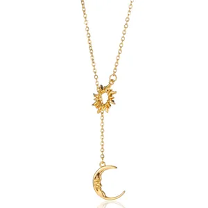 Detailed view of 18K gold plated sun and crescent moon charms on a fine lariat chain