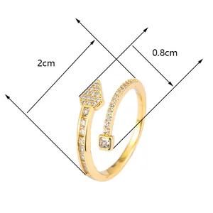 Macro view of gold arrow zircon open ring showing 2cm diameter and 0.8cm ornament width
