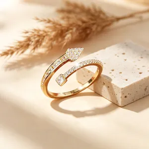 Elegant gold-plated open arrow ring featuring sparkling cubic zirconia stones for women