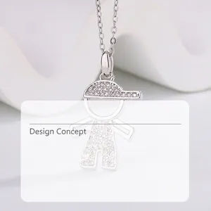 Detailed macro view of a cartoon boy pendant necklace with shimmering zircon stones