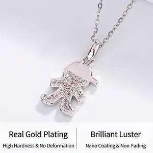 Close-up of a cartoon boy pendant necklace with sparkling pink and clear stones