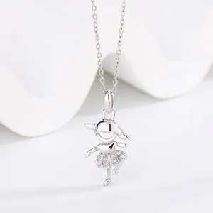 Close-up detail of a cute cartoon girl pendant necklace with sparkling micro-pave stones
