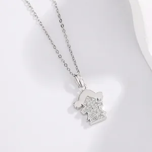 Close-up of a silver-toned cartoon girl pendant necklace with pavé stones