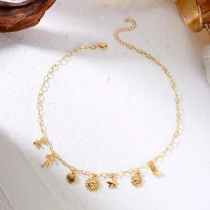 Detailed view of a gold vacation style necklace featuring sun, star, and boot charms.