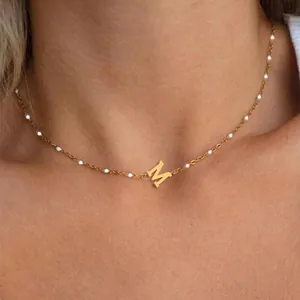Minimalist gold initial M necklace with dainty white imitation pearl chain for women