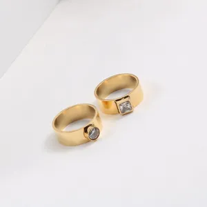 Macro view showing the fine details of gold-plated rings with round and square zircon stones