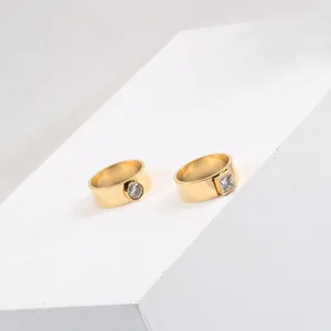 Detail shot of 18k gold plated titanium steel rings with square and round zircons