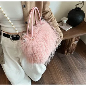 Detailed view of a pink faux fur handbag with elegant pearl chain strap and handles
