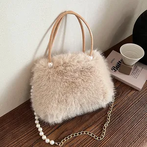Chic beige fuzzy handbag with pearl accents and gold chain strap for autumn winter