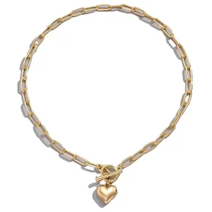 Elegant gold paperclip chain necklace featuring a 3D heart pendant and OT toggle clasp