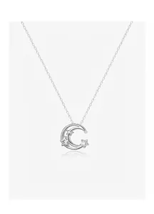 Detail of silver crescent moon necklace with sparkling star accents and cubic zirconia