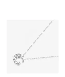 Detailed close-up of a silver star and moon pendant necklace with sparkling zircon stone.