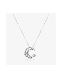 Close-up of stainless steel star and moon necklace pendant with cubic zirconia