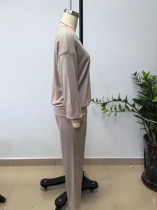 Side profile of a comfortable women's two-piece solid color beige lounge set on a mannequin
