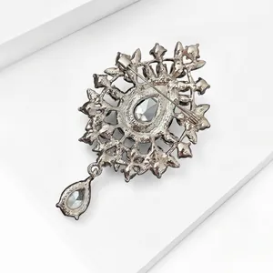 Elegant vintage style silver plated brooch featuring a teardrop glass pendant back view details