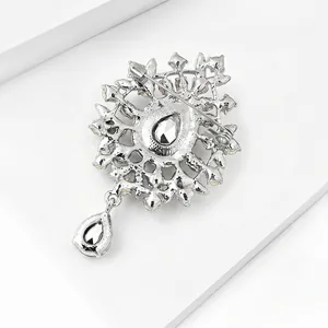 Detailed back view of a silver glass pendant brooch with water-drop crystal elements.