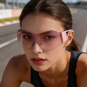 Close-up detail of model wearing pink rimless Y2K sports sunglasses on a racetrack