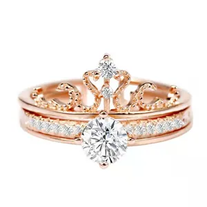Elegant rose gold crown two-in-one projection ring set with brilliant sparkling crystals.