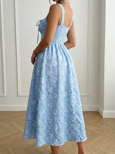 Elegant light blue floral jacquard midi dress featuring a backless smocked design.