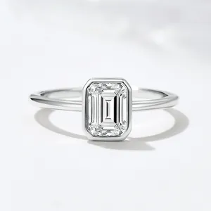 Close-up of elegant S925 silver ring with an emerald-cut zircon in a bezel setting
