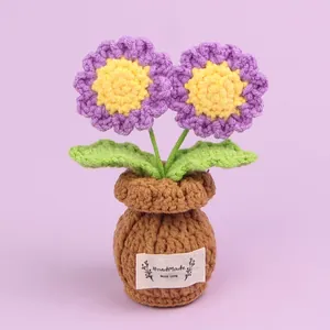 Handmade purple crocheted flower pot decoration with a 'Handmade with Love' tag label