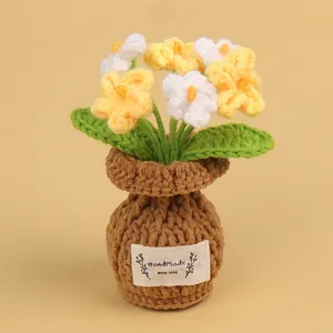 Charming handmade crochet yellow and white potted flowers for cozy desk decoration