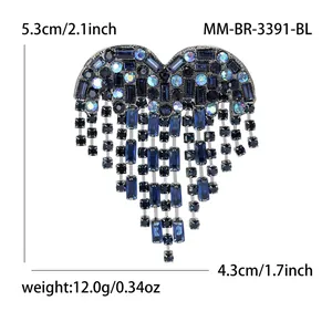 Herzförmige Brosche mit blauen Strasssteinen, Fransen, 5,3 cm Länge und 12,0 g Gewicht.