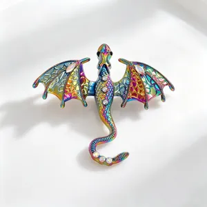 Detail of rainbow iridescent dragon brooch with sparkling crystals and intricate wings