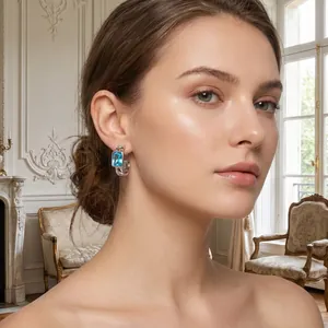 Elegant light luxury stainless steel hoop earrings featuring rectangular blue zircon on model