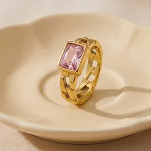 Close-up detail of a vintage 18K gold plated chain ring with rectangular pink zircon