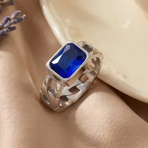 Close-up of vintage stainless steel ring with rectangular blue zircon