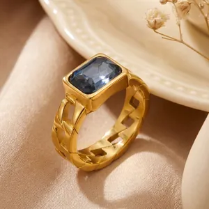 Macro view of vintage 18K gold plated titanium steel ring with rectangular blue zircon