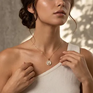 Elegant gold-finished rabbit pendant necklace with sparkling zircons shown on a model