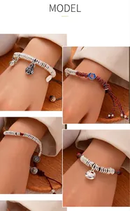 Detail view of handmade braided silver bead bracelets with adjustable Chinese style charms