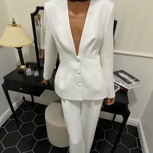 Chic white two-piece suit set with deep V-neck blazer and slim fit trousers for spring