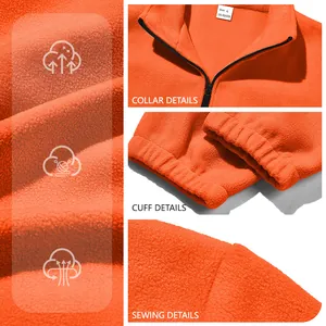 Vue détaillée de la veste polaire orange pour homme montrant le col, les poignets et le tissu