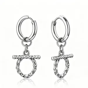 Close-up of stainless steel OT buckle earrings with a vintage pleated texture.