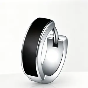 Close-up of a silver-toned stainless steel hoop earring featuring a black enamel inlay design