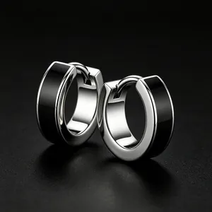 Detailed close-up view of stainless steel hoop earrings with sleek black enamel inlay.