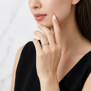 Elegant s925 sterling silver eternity ring with sparkling moissanite on model's hand