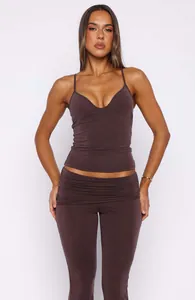Detailed shot of brown V-neck camisole top and matching ruched waist yoga flare pants