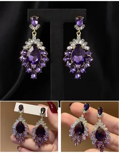 Detailed close-up of luxury vintage purple rhinestone statement drop earrings for women