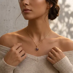 Elegant gold titanium steel necklace with blue gemstone flower pendant on model