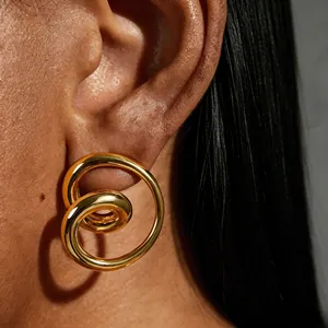 Elegant 18k gold plated stainless steel spiral hollow stud earrings shown on model ear